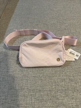 NWT. Lululemon Everywhere Belt Bag Pink with Gold Hardware 1L